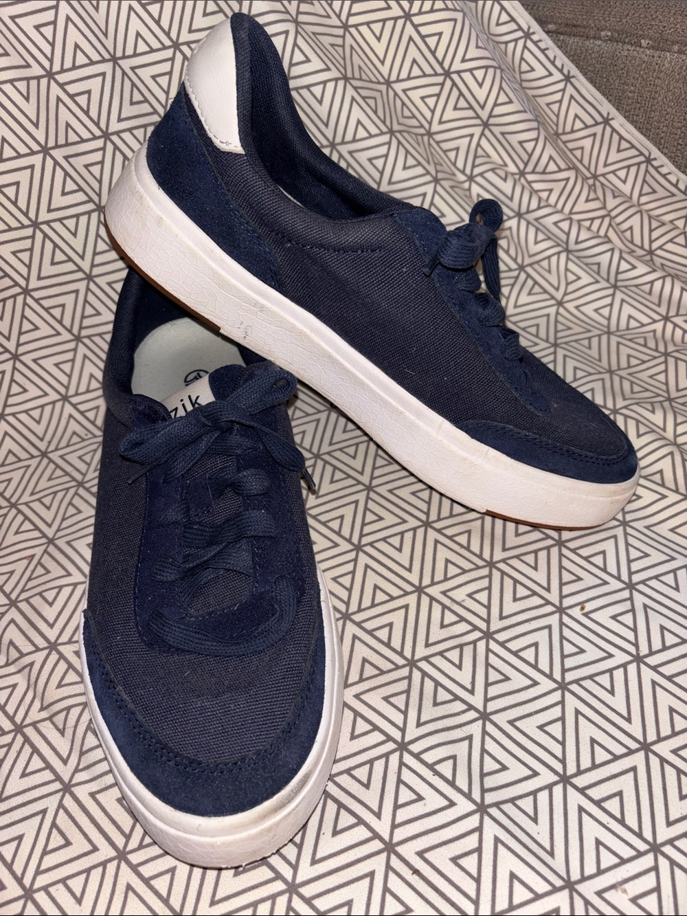 Navy Low-Top Canvas Sneakers with White Sole slide on.